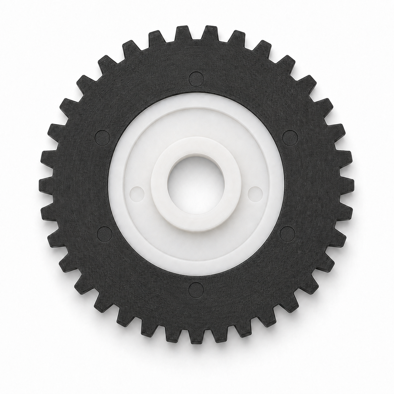 Front view of the black gear and white core showing the central bore
