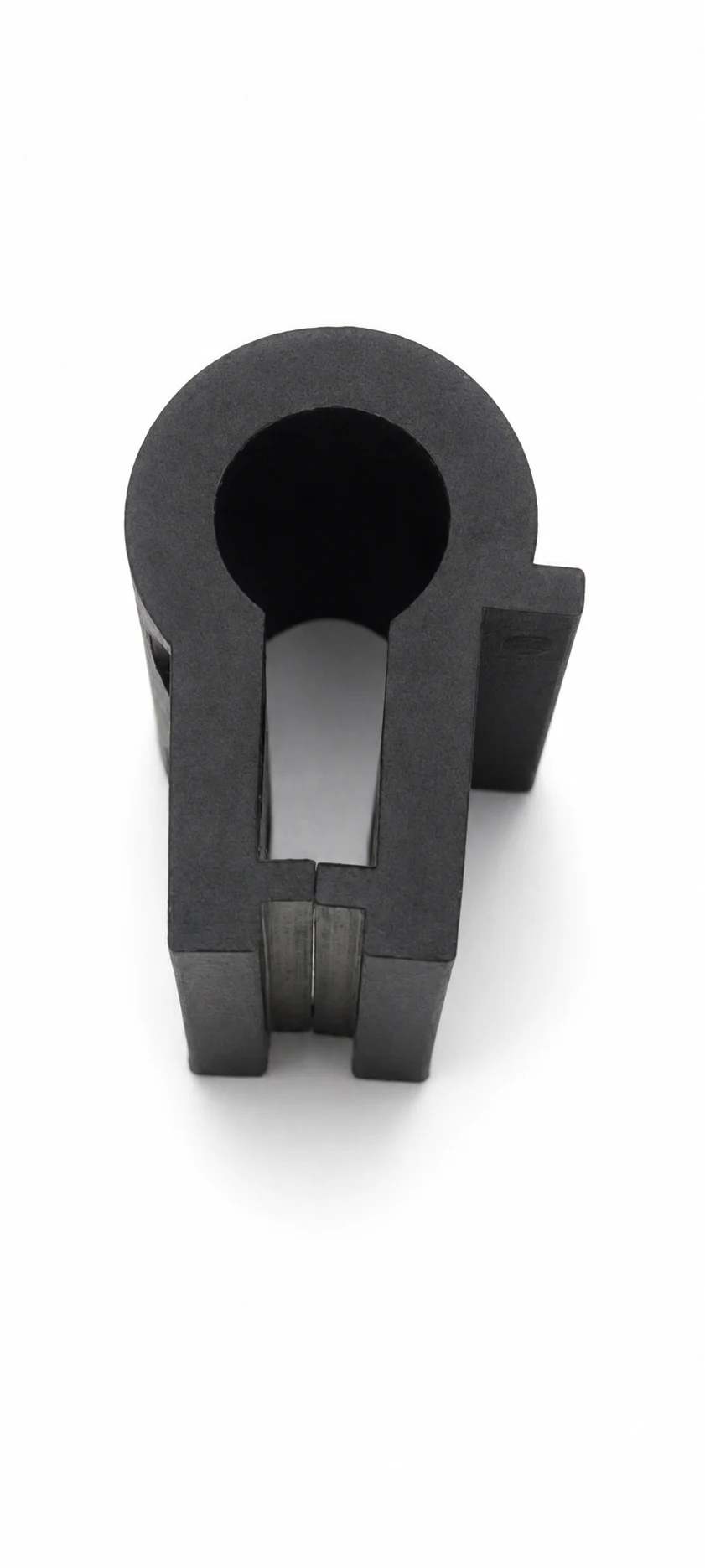 Black moulded clamp housing with keyhole opening