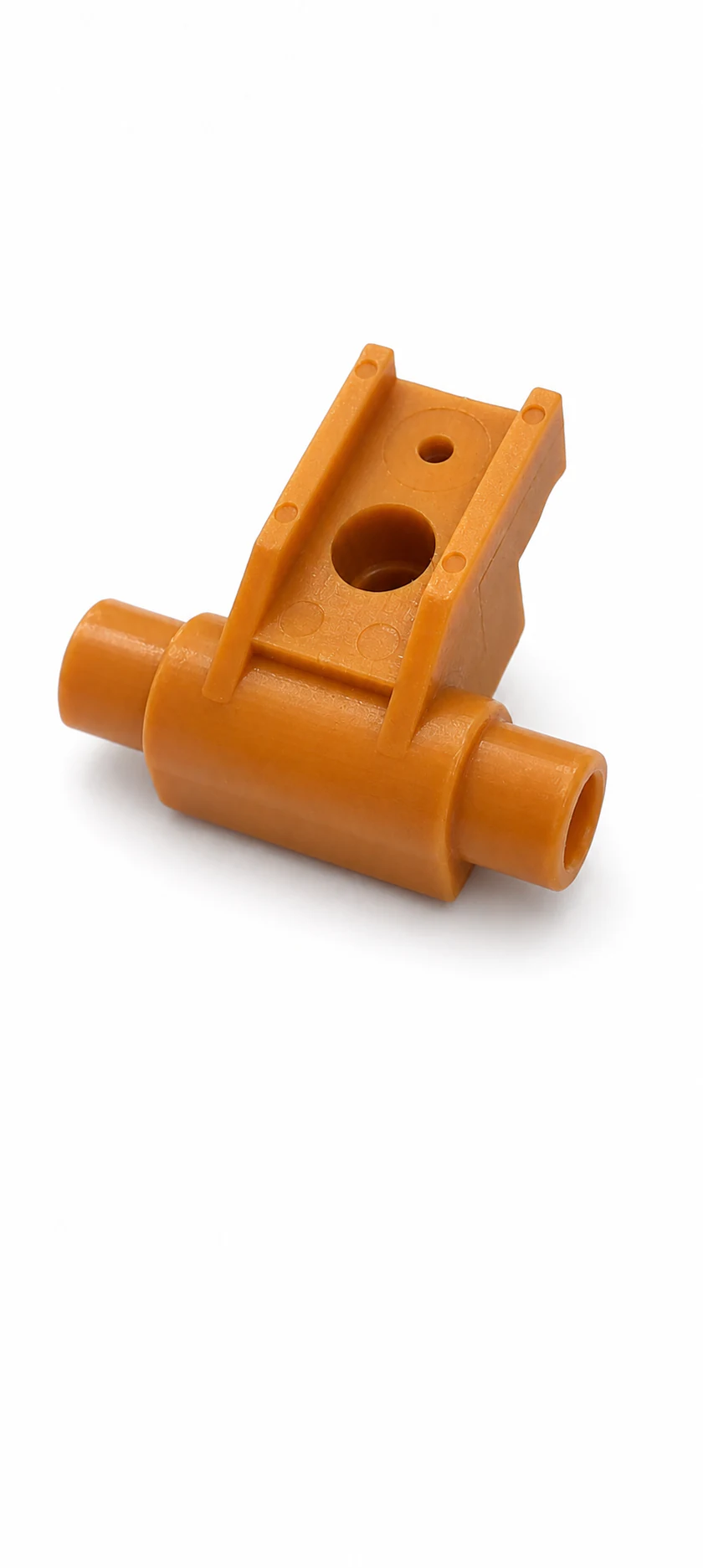 Orange moulded housing with opposing cylindrical ports